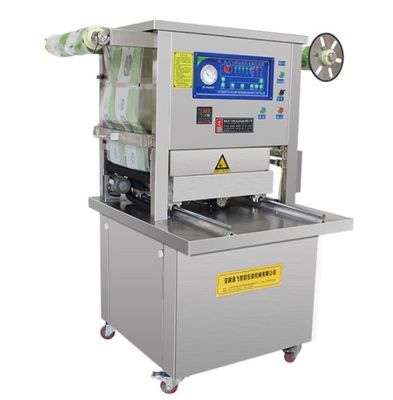 Vacuümverpakkingsmachine voor verpakkingsmateriaal van kunststof voor het afdichten van bakken in gemodificeerde atmosfeer